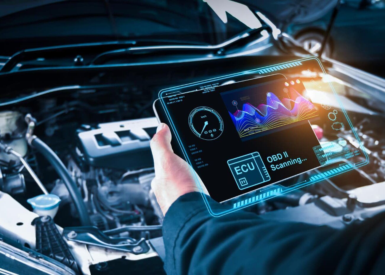 Technician carrying out an OBD diagnostic scan