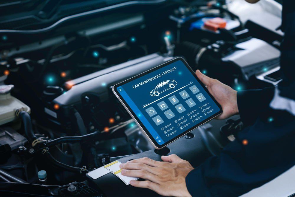 Technician using a diagnostic tablet on a vehicle